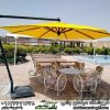 چترباغی مدل پایه کنار زرد رنگ طرح هشت ضلعی به همراه میزوصندلی کالسکه ای شش نفره در کنار استخری زیبا در ویلایی زیبا و لاکچری