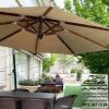 چترپایه کنار یا سایه‌بان پایه کنار به همراه ست شش نفره مبلمان حصیری در یک باغ ویلای زیبا